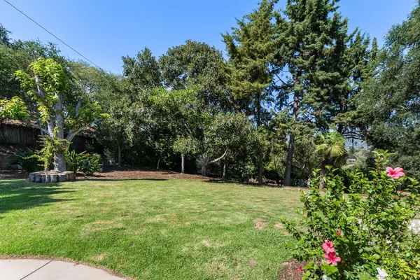a view of outdoor space with deck and yard