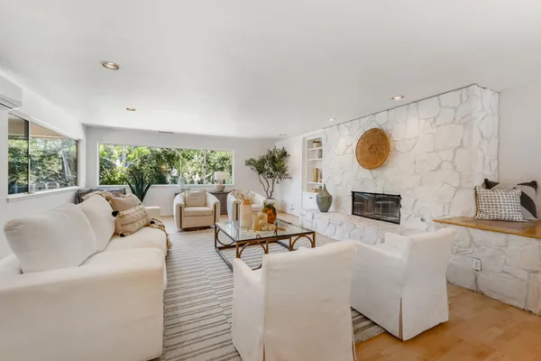 a living room with furniture and a fireplace