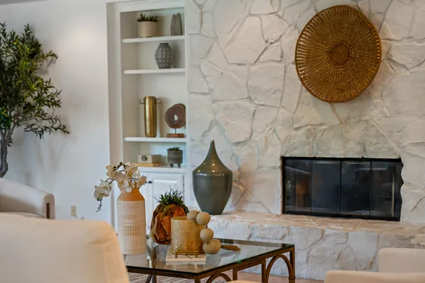 a living room with furniture and a fireplace