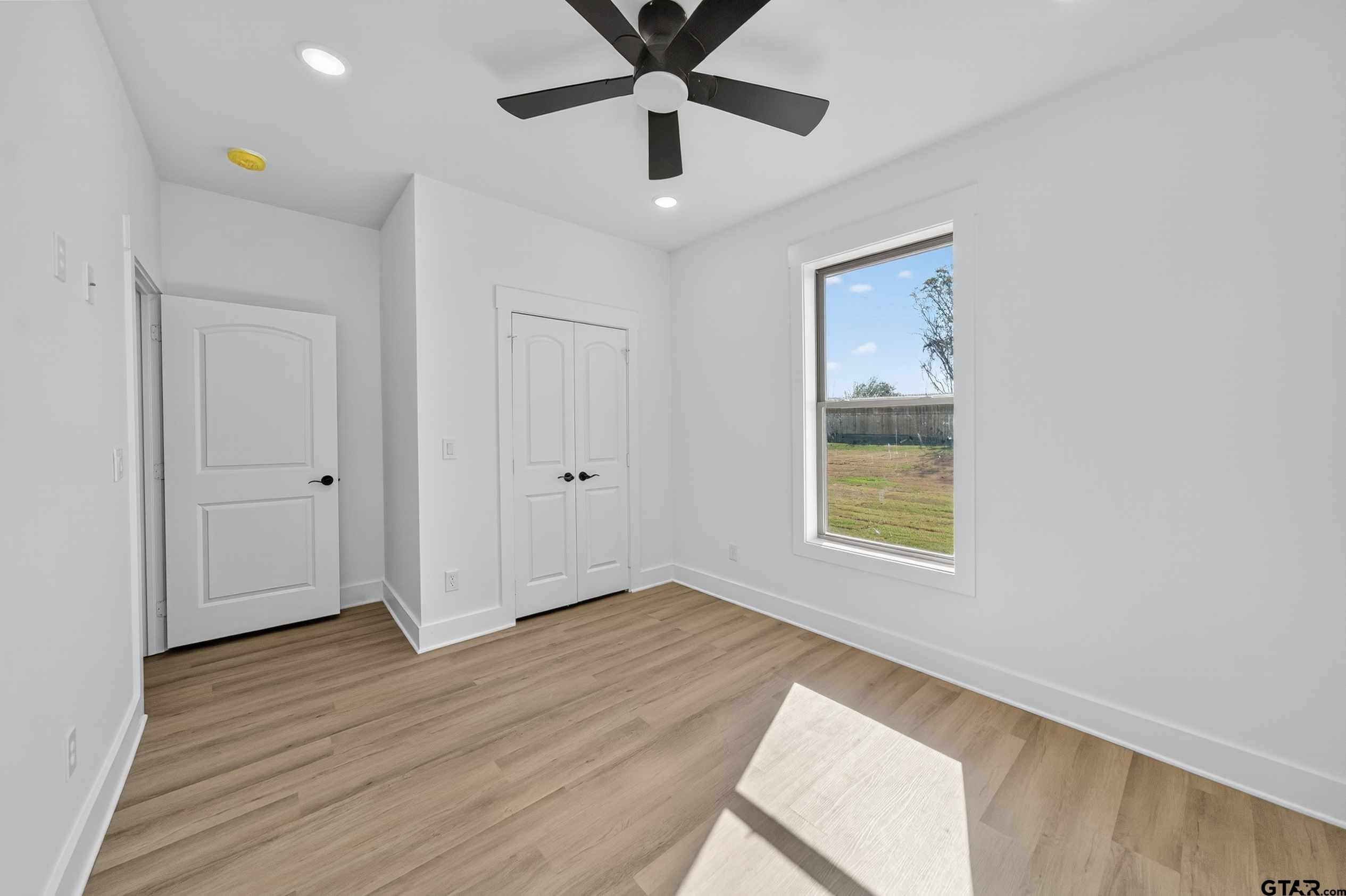 173 Sides Boulevard Bullard, TX 75757 - Photo 22 of 48 wooden floor in an empty room with a window