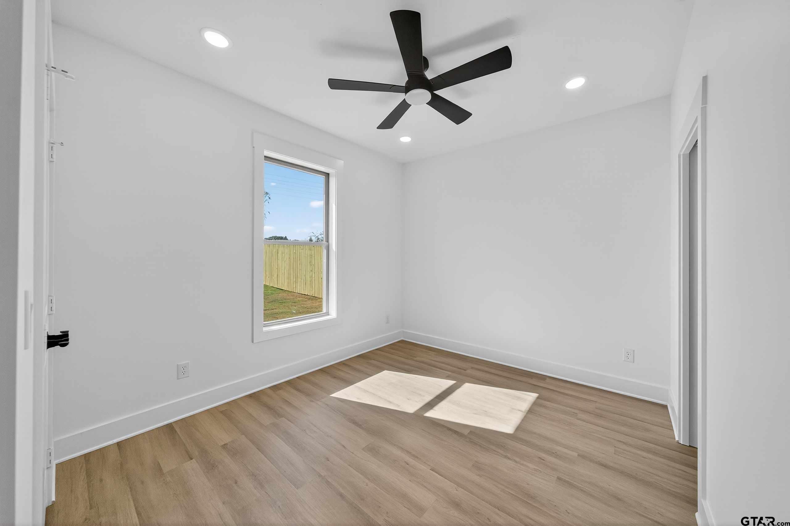 173 Sides Boulevard Bullard, TX 75757 - Photo 24 of 48 a view of empty room with wooden floor and fan
