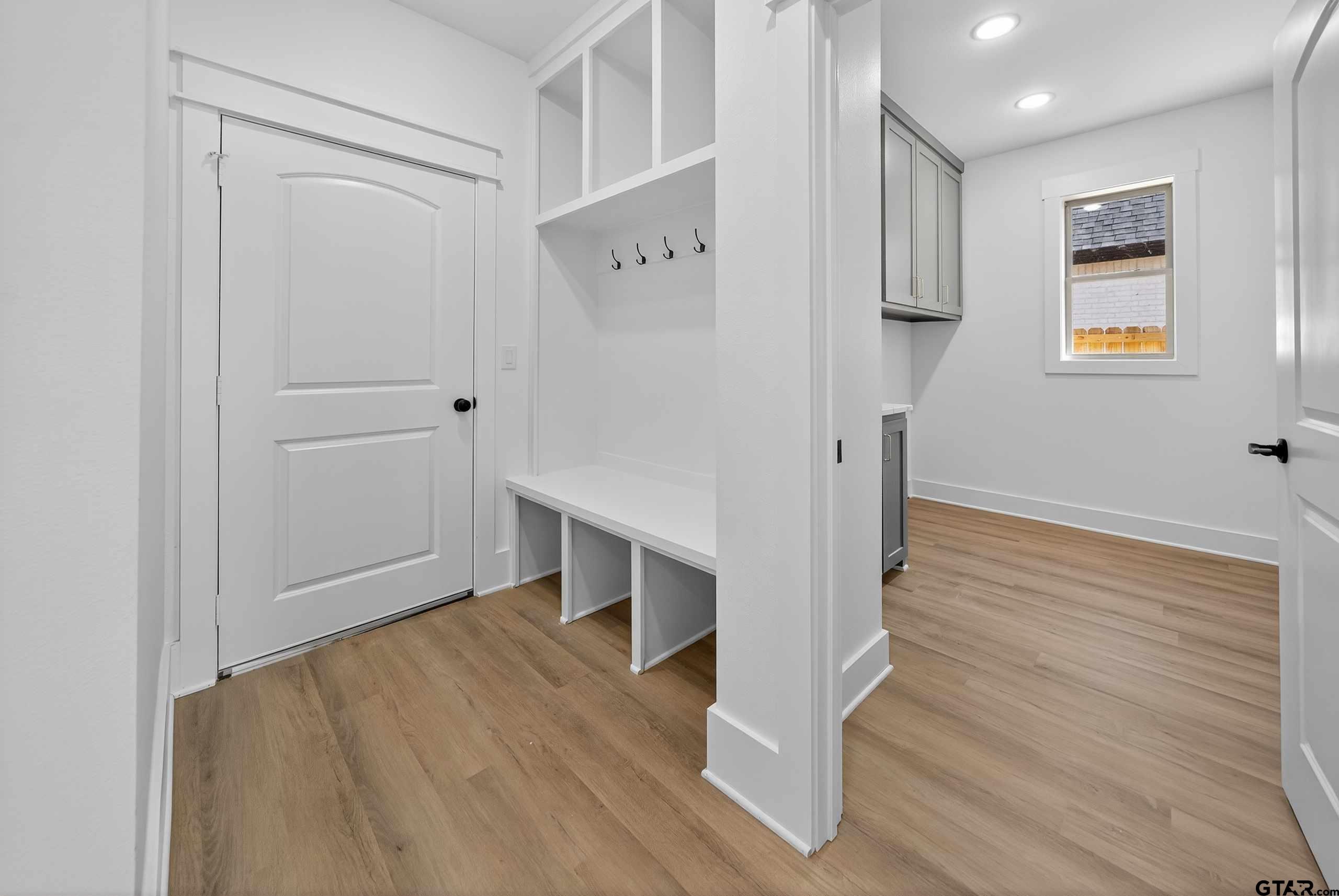 173 Sides Boulevard Bullard, TX 75757 - Photo 36 of 48 a view of a hallway with wooden floor and staircase