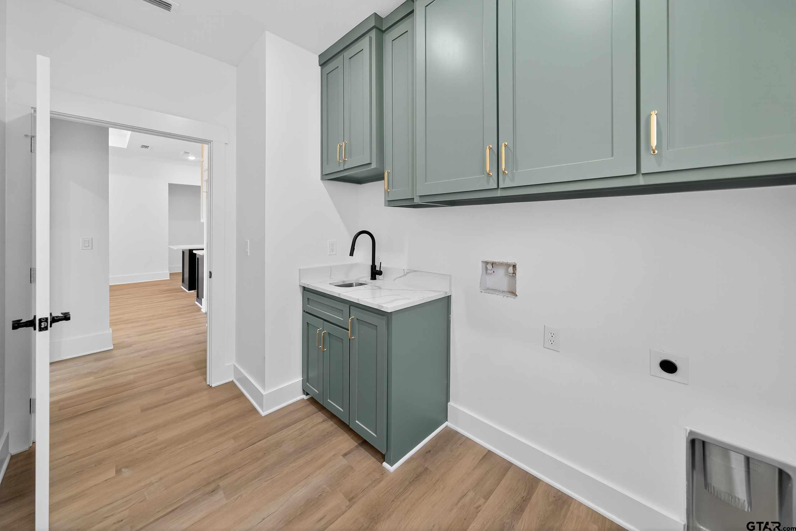 173 Sides Boulevard Bullard, TX 75757 - Photo 41 of 48 a kitchen with sink and cabinets