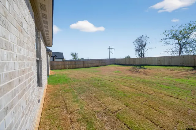 a view of a house with a big yard