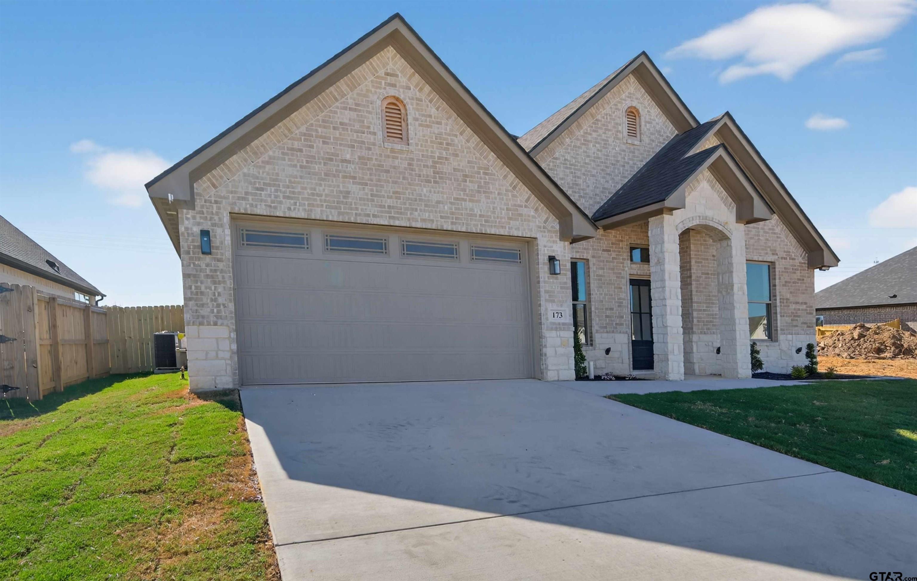 173 Sides Boulevard Bullard, TX 75757 - Photo 48 of 48 a front view of a house with a yard and garage