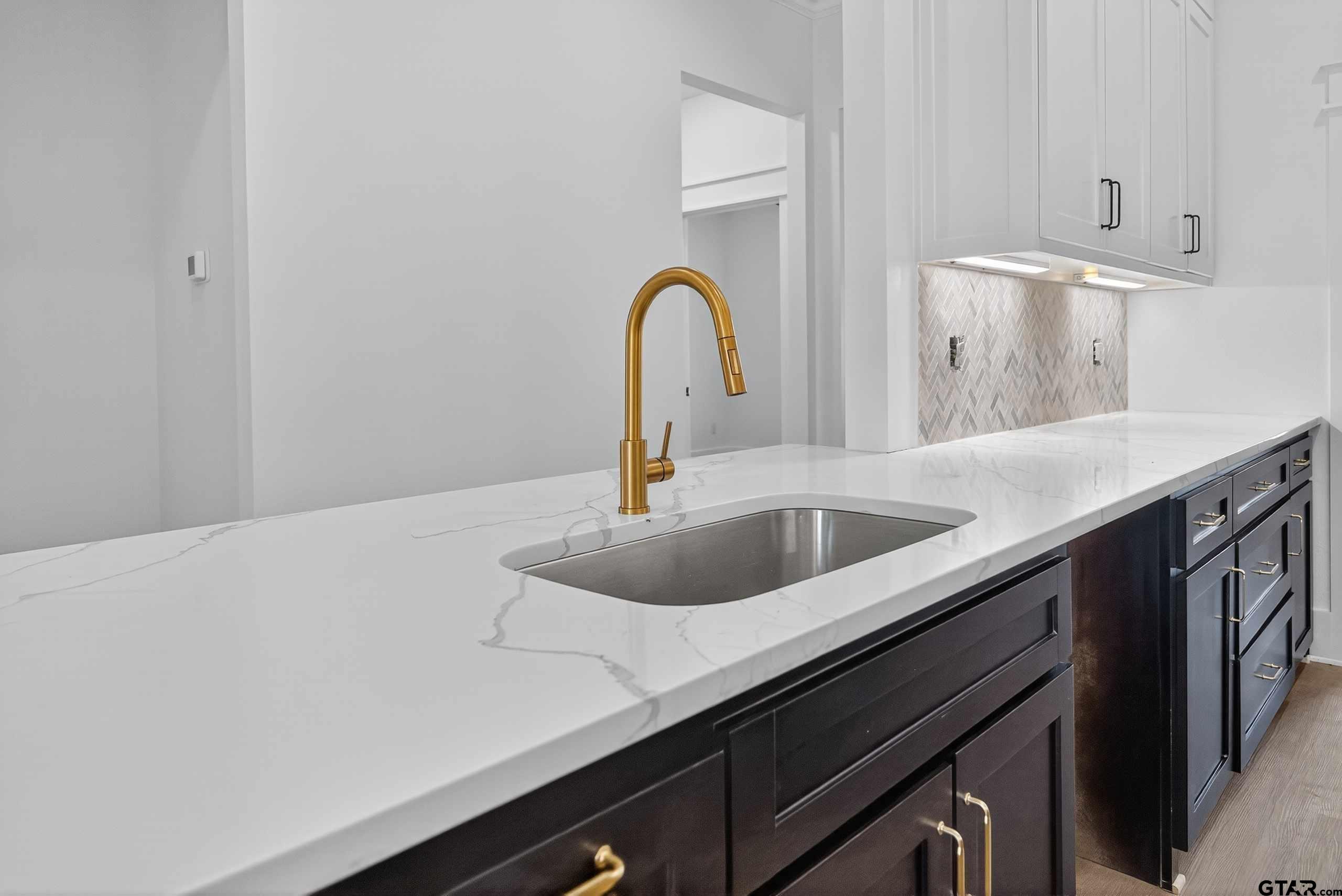 173 Sides Boulevard Bullard, TX 75757 - Photo 5 of 48 a close view of a sink and dishwasher in a kitchen