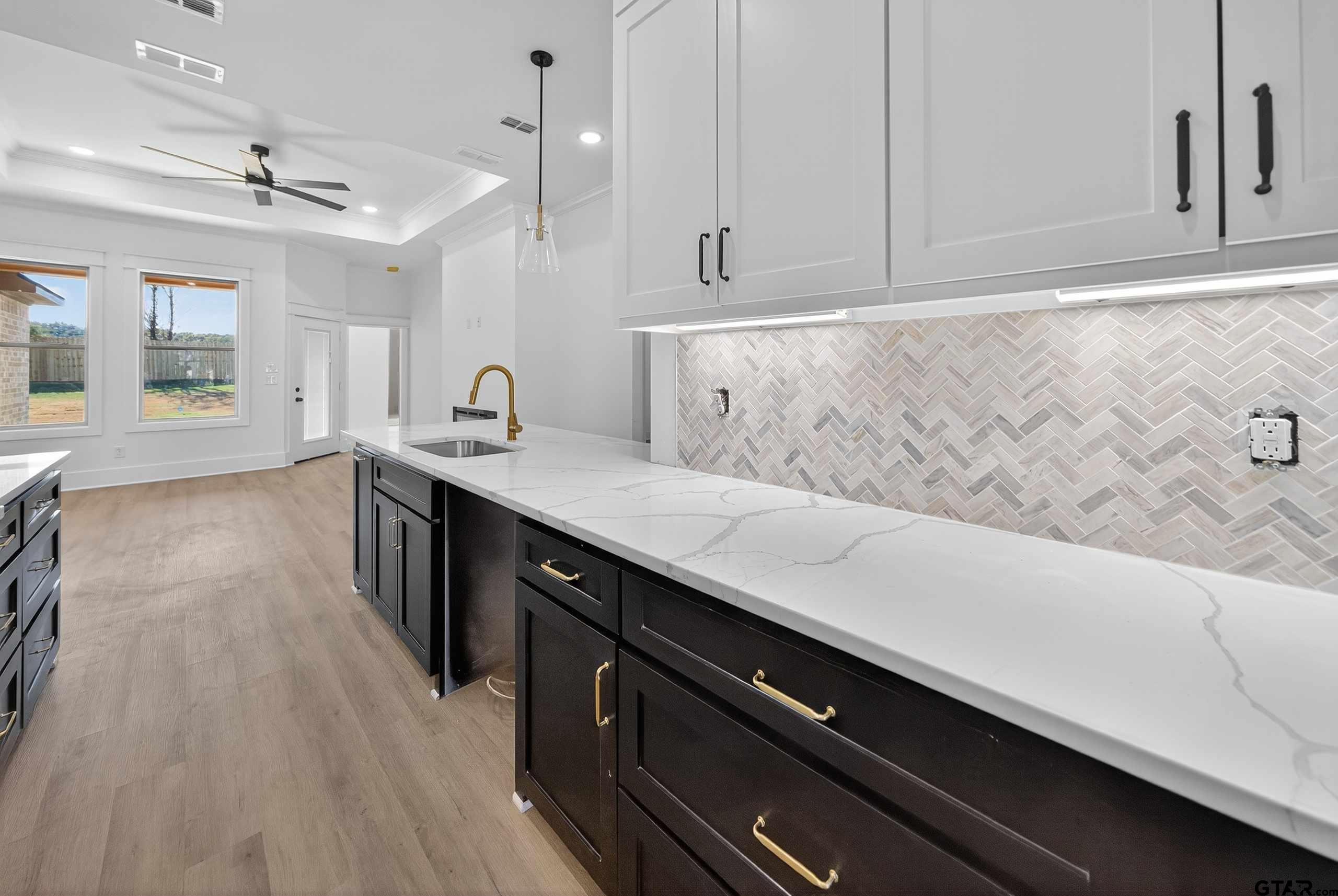 173 Sides Boulevard Bullard, TX 75757 - Photo 7 of 48 a kitchen with a sink and cabinets