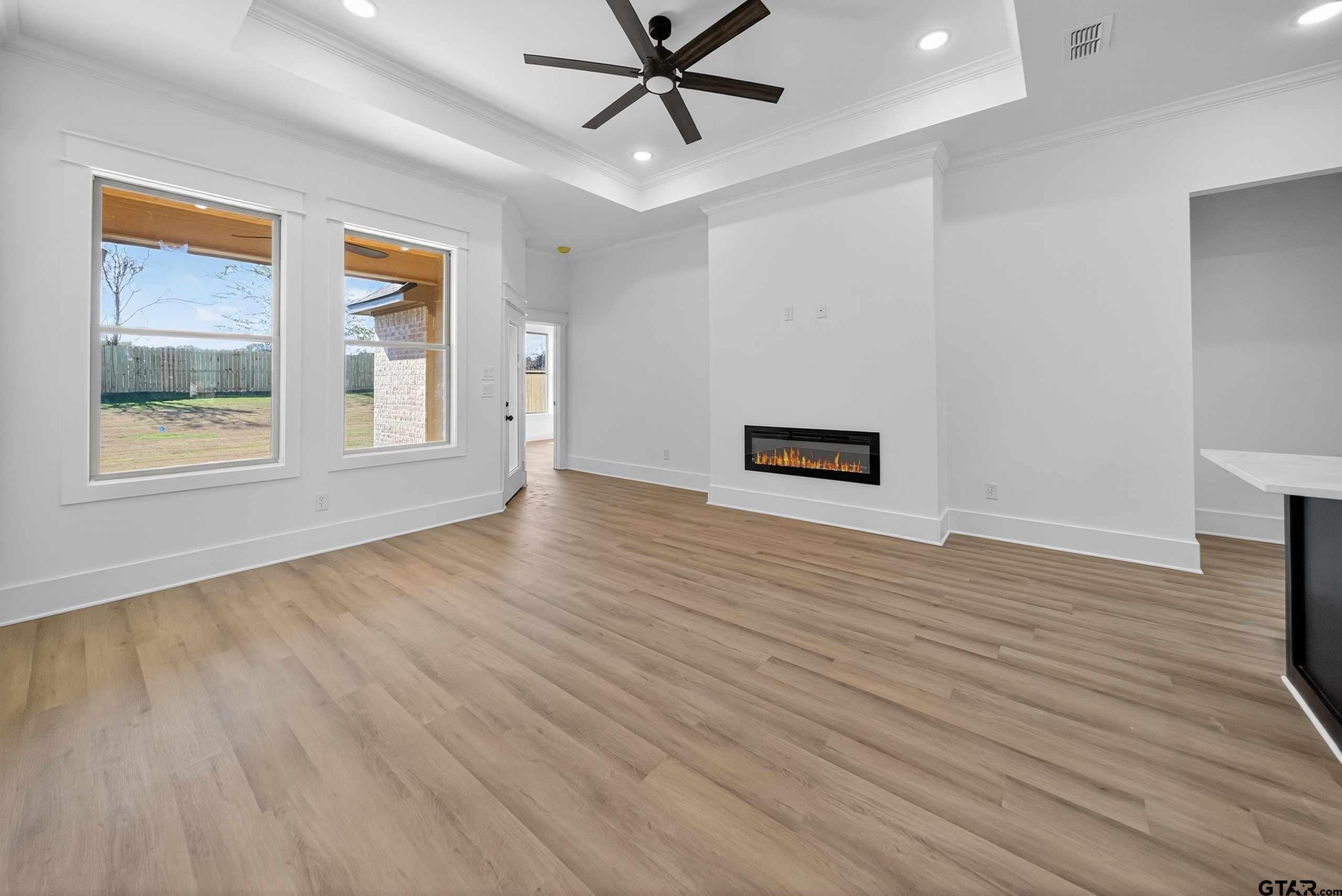 173 Sides Boulevard Bullard, TX 75757 - Photo 10 of 48 wooden floor in an empty room with a window