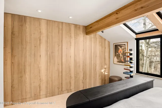 a living room with a large window and couch