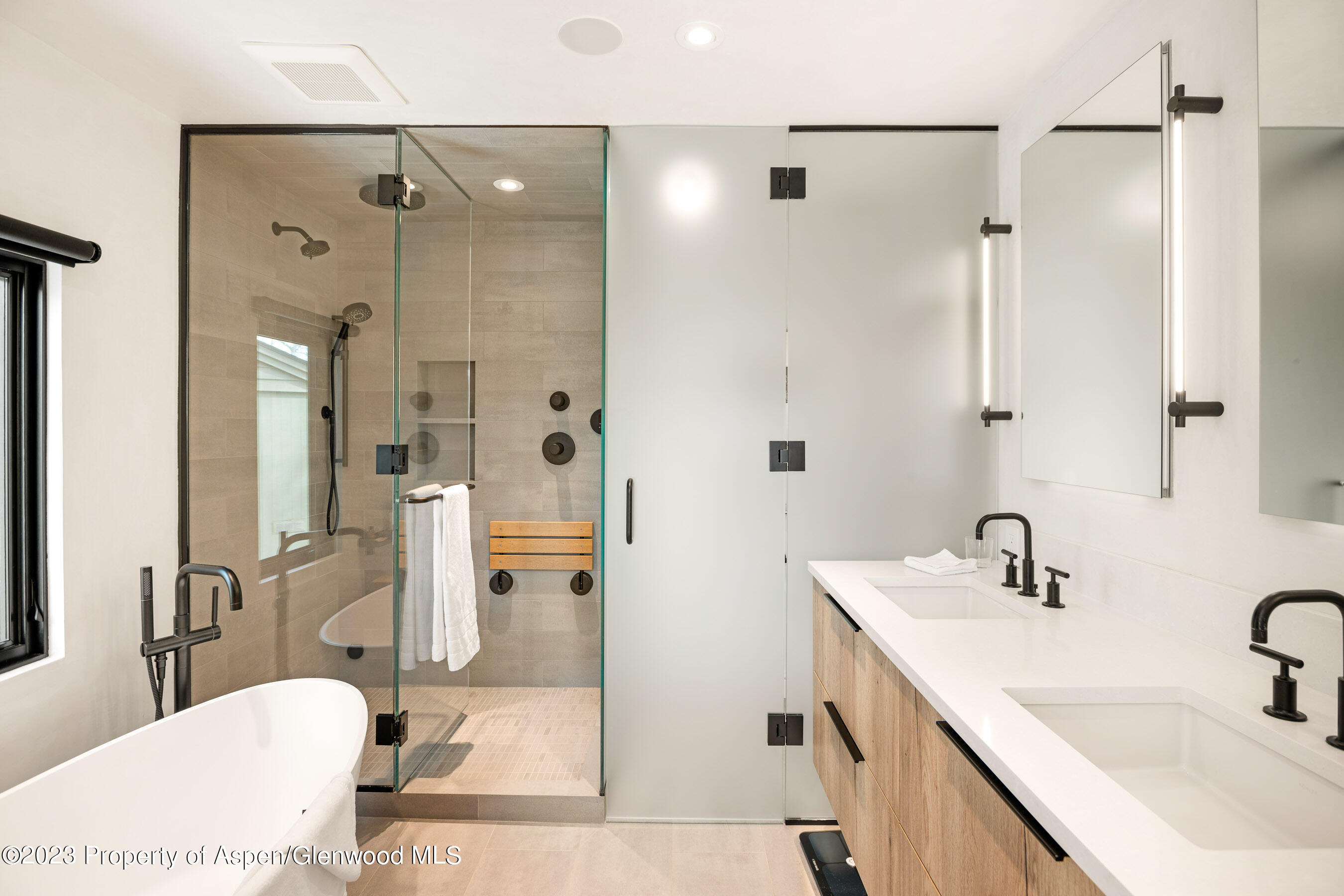 100 North 8th Street, Unit 15 Aspen, CO 81611 - Photo 14 of 27 a bathroom with a tub sink shower and mirror