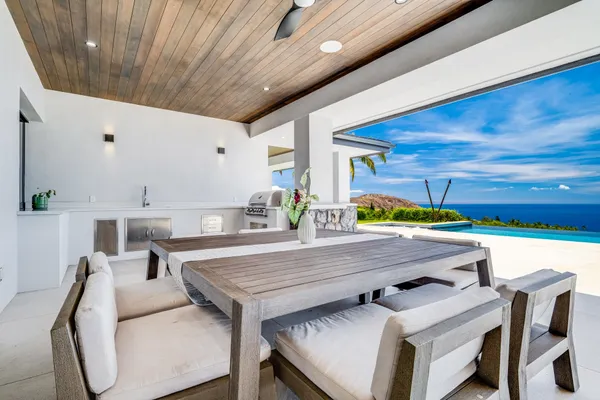 a dining room with a table and chairs