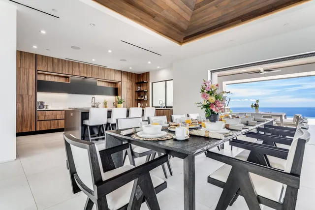 a kitchen with a table and chairs in it