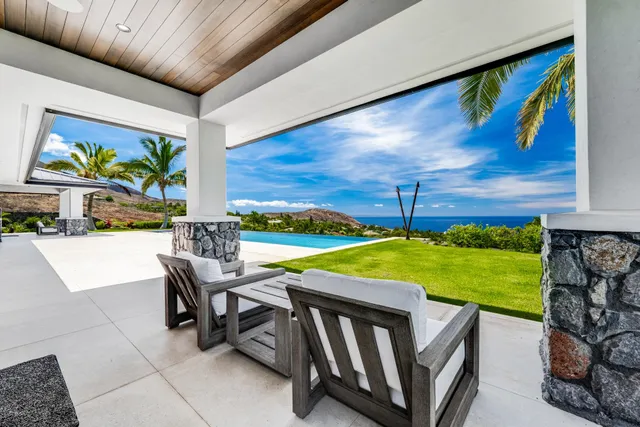 a view of a patio with a table and chairs