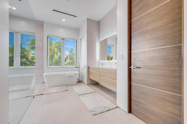 a bathroom with a bathtub and window