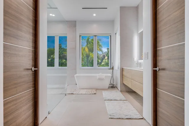 a bathroom with a bathtub and shower