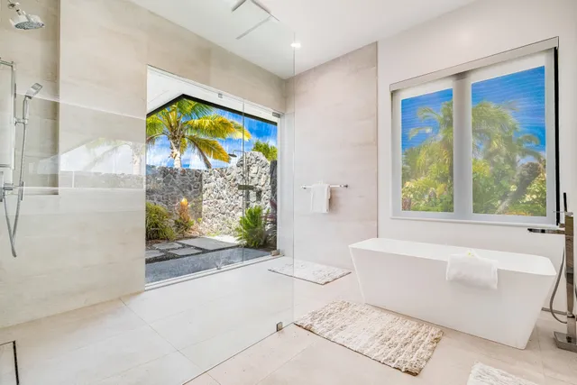 a bathroom with a bathtub and a shower