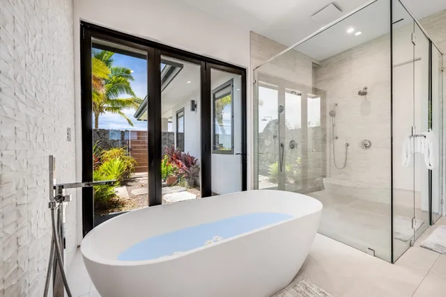 a view of a hallway with windows and chandelier