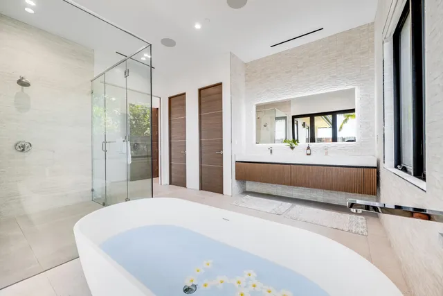 a bed room with a bed and a large window