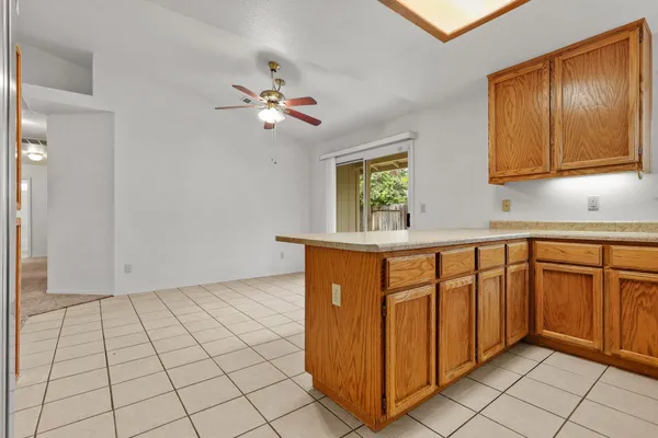 a view of a kitchen cabinets and a stove top oven