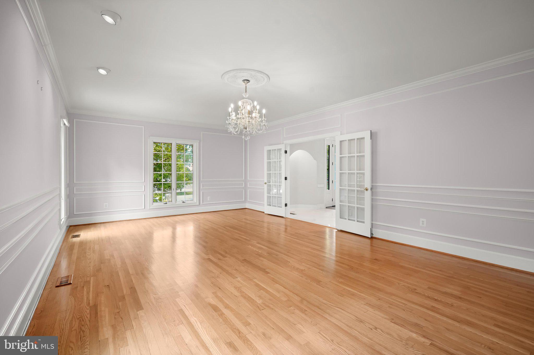 9809 Hall Road Potomac, MD 20854 - Photo 7 of 60 wooden floor in an empty room with a window