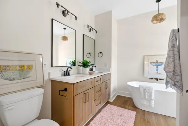 a bathroom with a bathtub and a shower