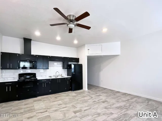 a kitchen with a sink and cabinets
