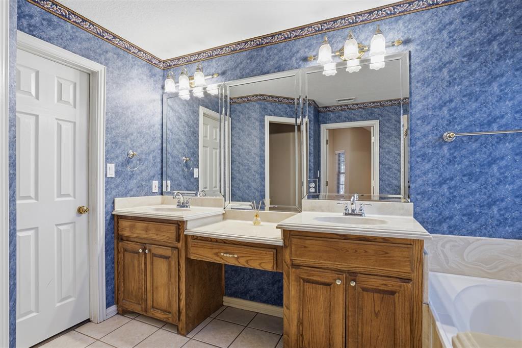 231 Bluff View Court Aledo, TX 76008 - Photo 17 of 34 a bathroom with a sink double vanity and a mirror