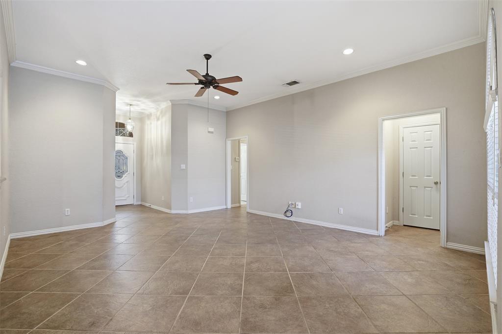 231 Bluff View Court Aledo, TX 76008 - Photo 19 of 34 a view of an empty room and a ceiling fan window