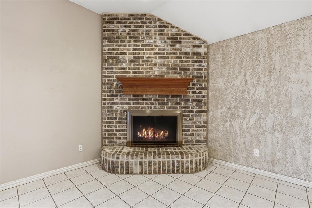 231 Bluff View Court Aledo, TX 76008 - Photo 22 of 34 a living room with a fireplace