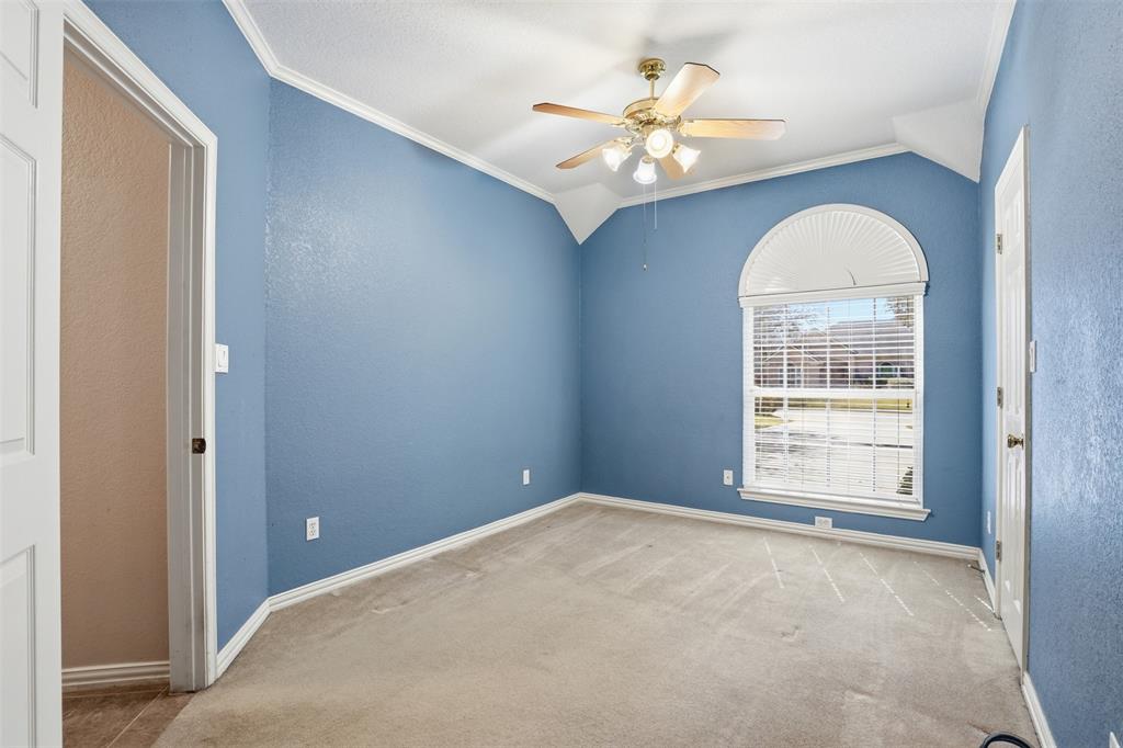 231 Bluff View Court Aledo, TX 76008 - Photo 10 of 34 an empty room with a chandelier fan and windows