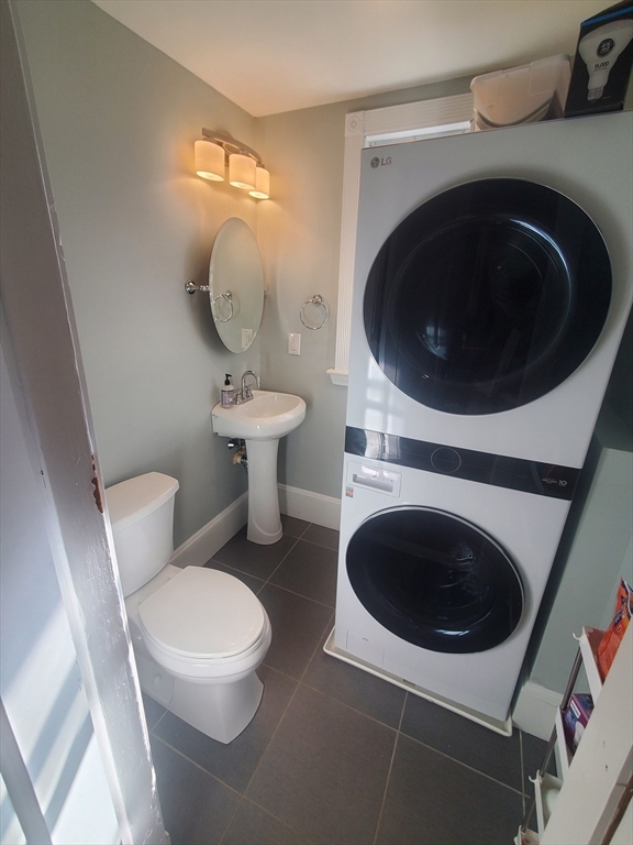 14 North Munroe Terrace, Unit 2 Boston, MA 02122 - Photo 10 of 19 a close view of a utility room with dryer and washer