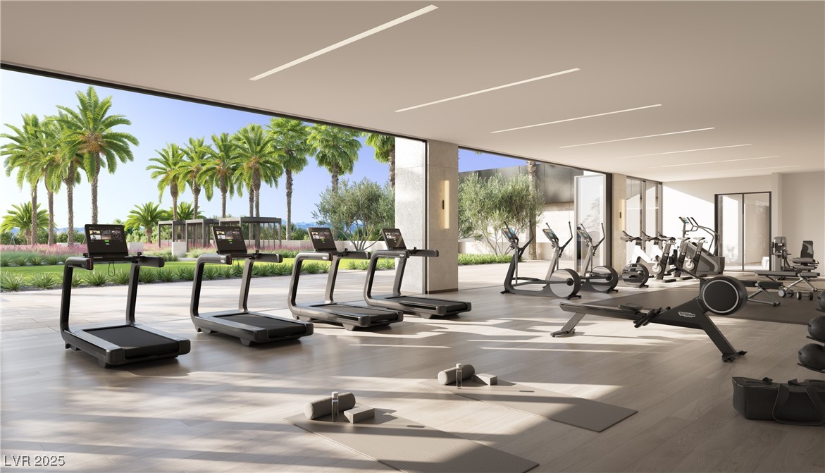 410 Rock Peak Drive, Unit 2402 Henderson, NV 89012 - Photo 3 of 11 Workout area featuring floor to ceiling windows and wood finished floors