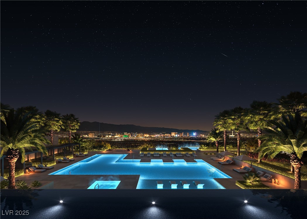 410 Rock Peak Drive, Unit 2402 Henderson, NV 89012 - Photo 5 of 11 Pool at twilight featuring an outdoor pool and a patio area