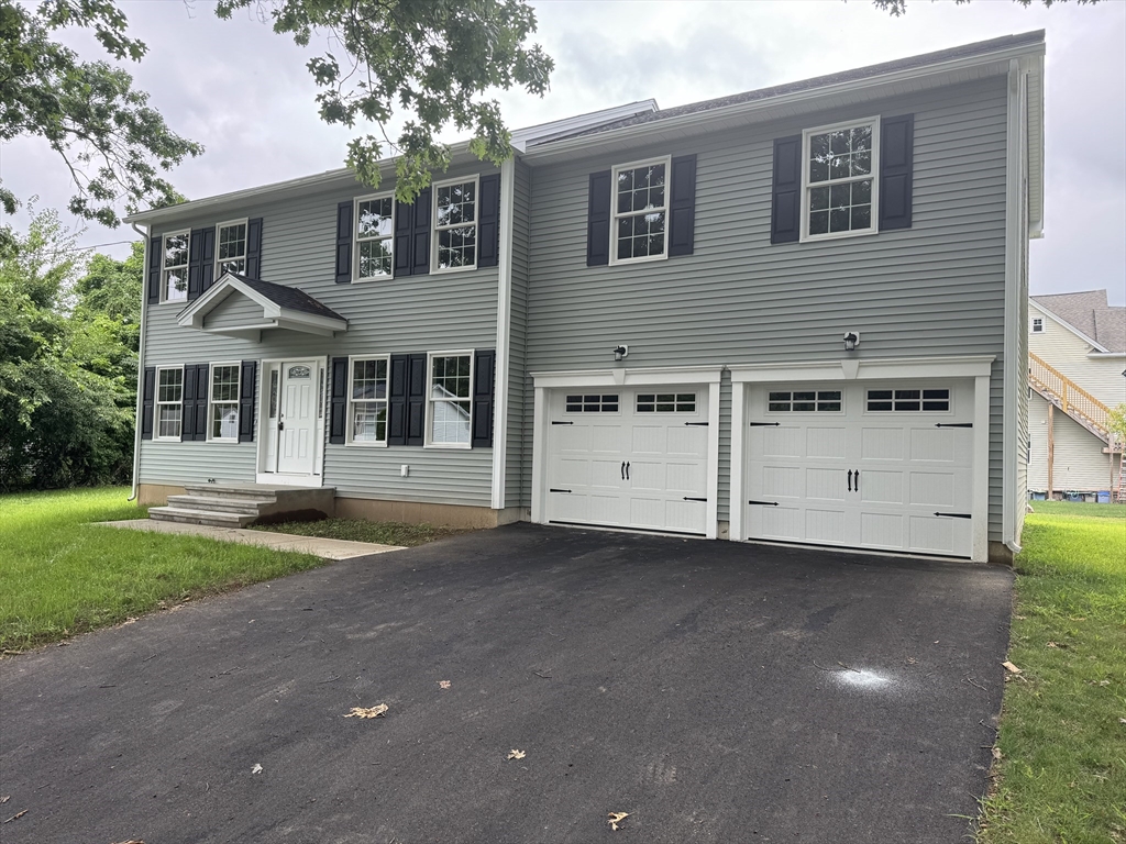 91 Tilton Street Springfield, MA 01109 - Photo 1 of 2 a view of a house with a yard