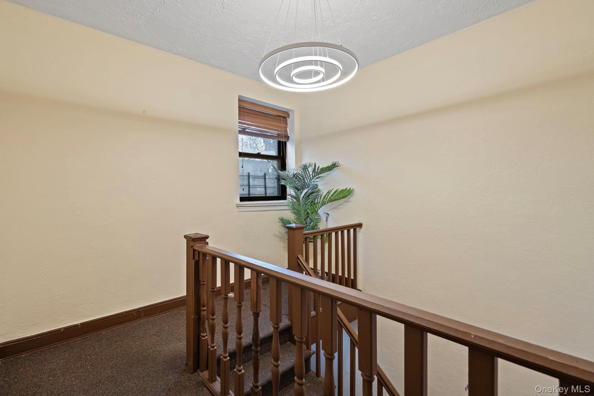 77-15 Ditmars Boulevard, Unit B2 Queens, NY 11370 - Photo 18 of 24 a view of entryway with stairs