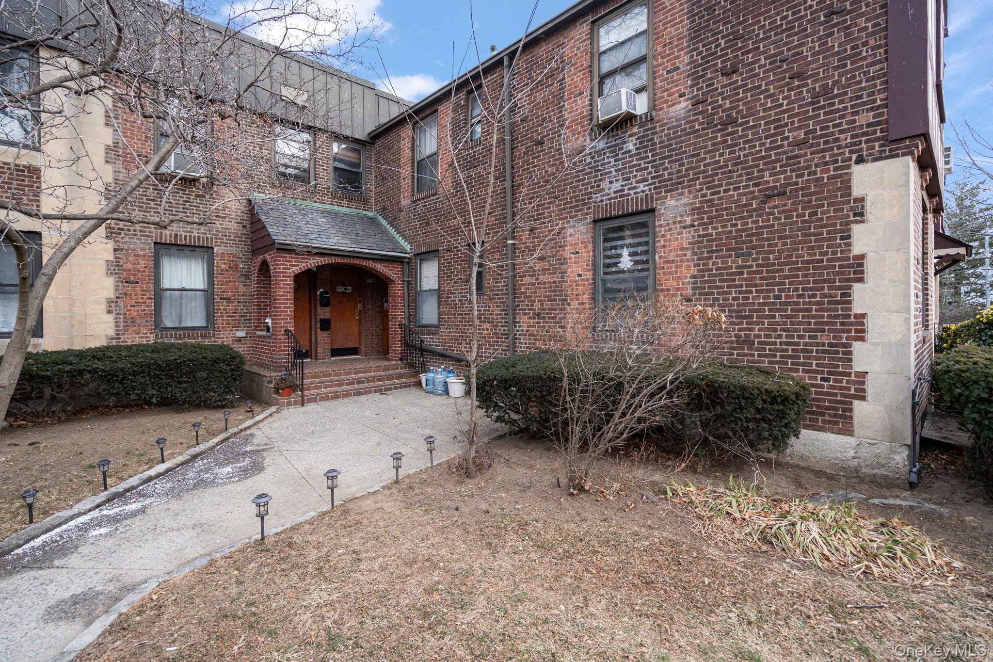 77-15 Ditmars Boulevard, Unit B2 Queens, NY 11370 - Photo 19 of 24 a front view of a house with garden