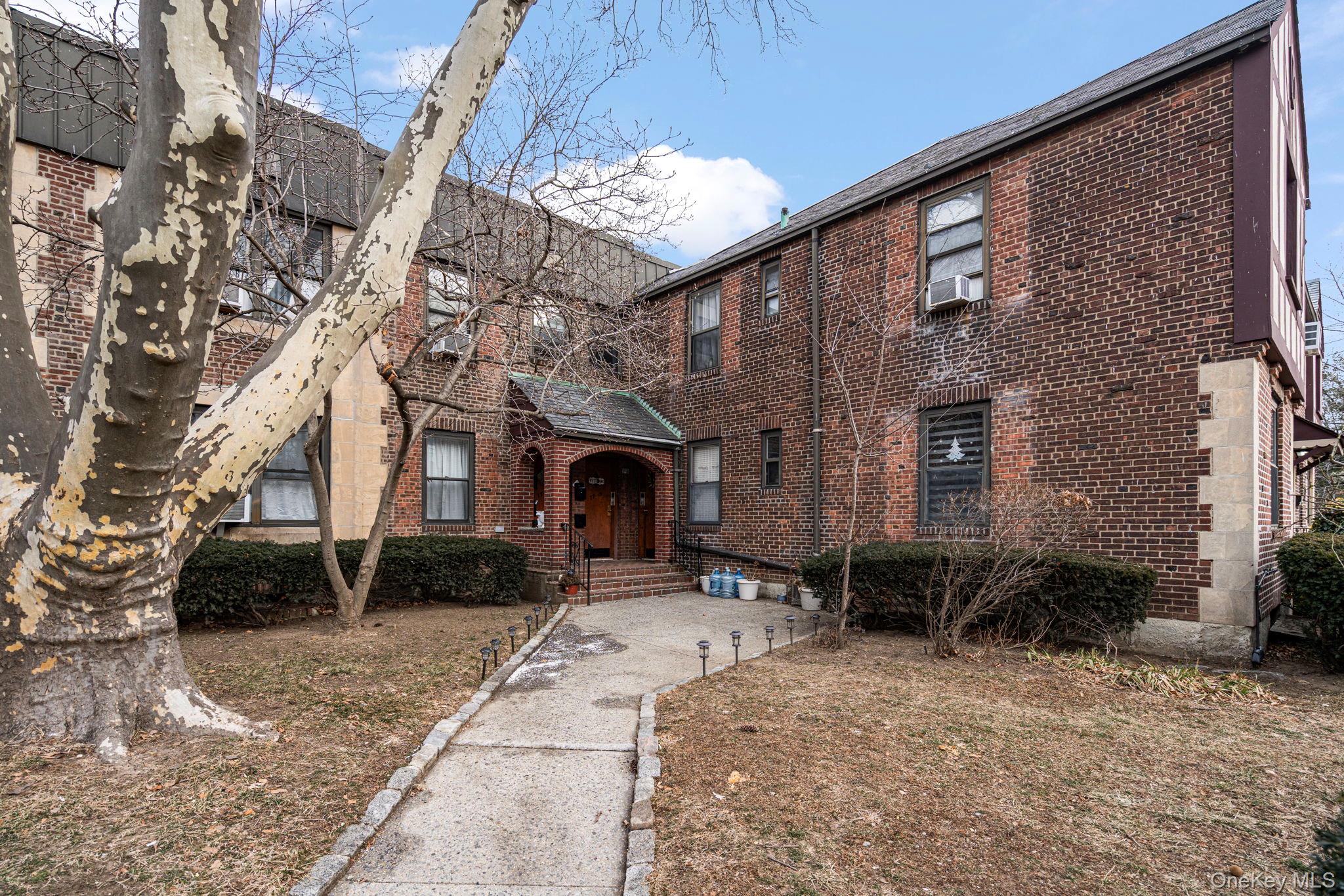 77-15 Ditmars Boulevard, Unit B2 Queens, NY 11370 - Photo 23 of 24 a brick building with a outdoor space