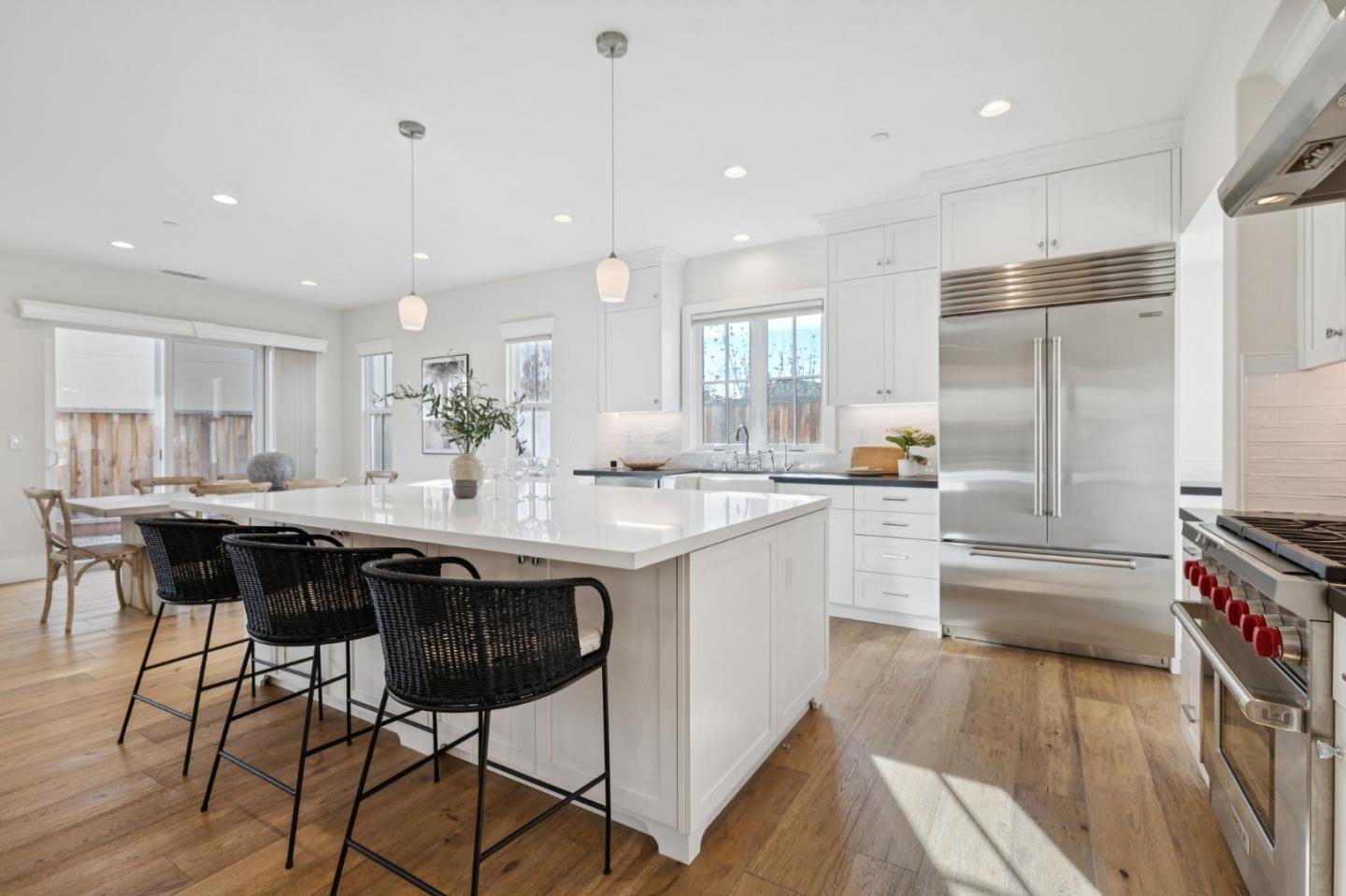 1103 Creed Street Milpitas, CA 95035 - Photo 11 of 74 a kitchen with stainless steel appliances granite countertop a sink a stove a refrigerator and island with wooden floor