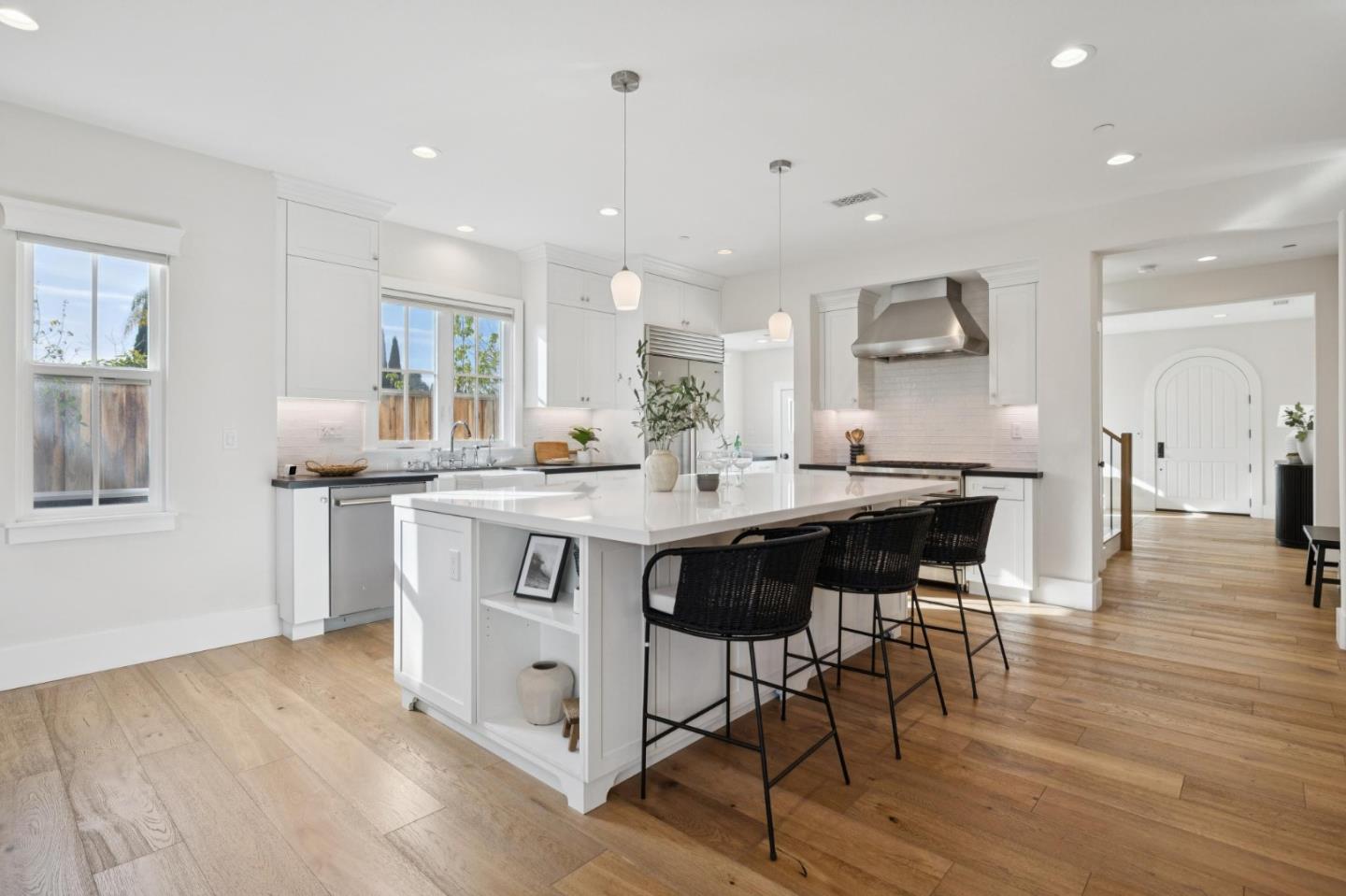 1103 Creed Street Milpitas, CA 95035 - Photo 13 of 74 a kitchen with stainless steel appliances kitchen island granite countertop a table chairs sink and cabinets