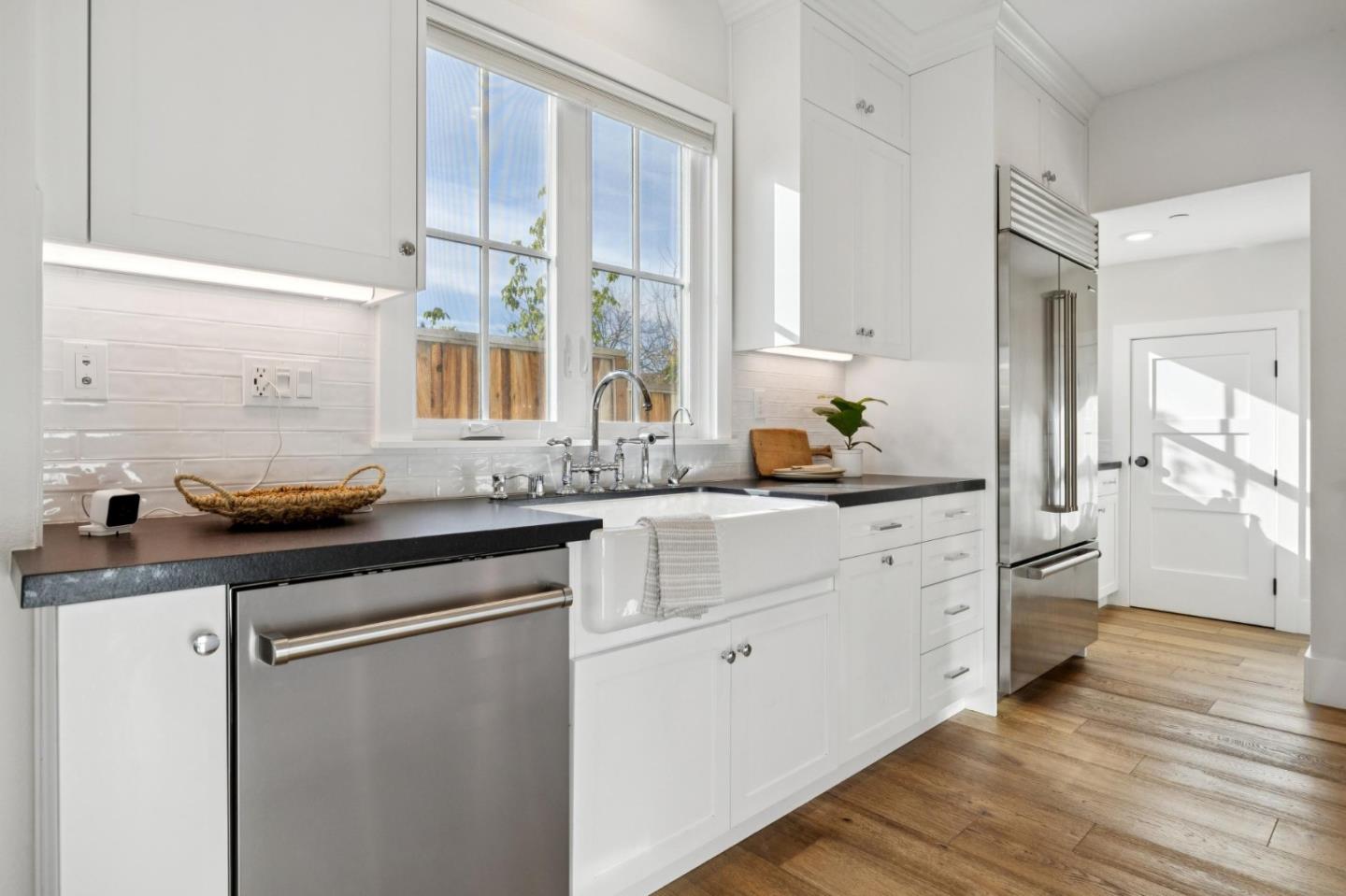 1103 Creed Street Milpitas, CA 95035 - Photo 17 of 74 a kitchen with stainless steel appliances white cabinets and wooden floors