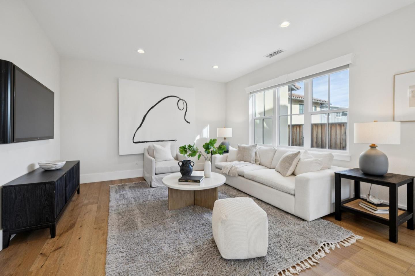 1103 Creed Street Milpitas, CA 95035 - Photo 23 of 74 a living room with furniture a flat screen tv and a large window
