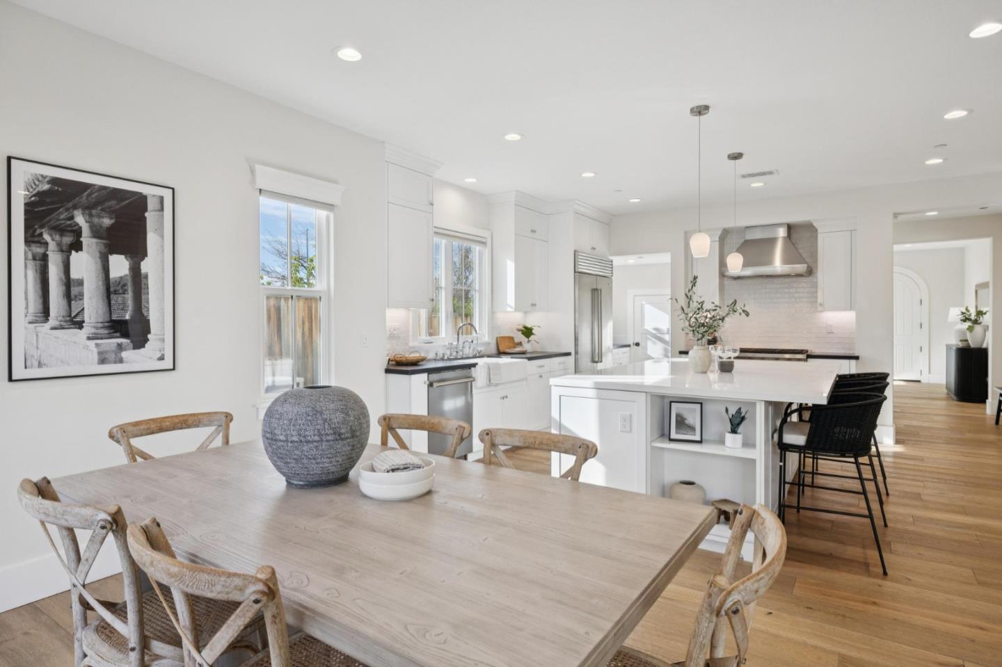 1103 Creed Street Milpitas, CA 95035 - Photo 29 of 74 a dining room with furniture a wooden floor and kitchen view