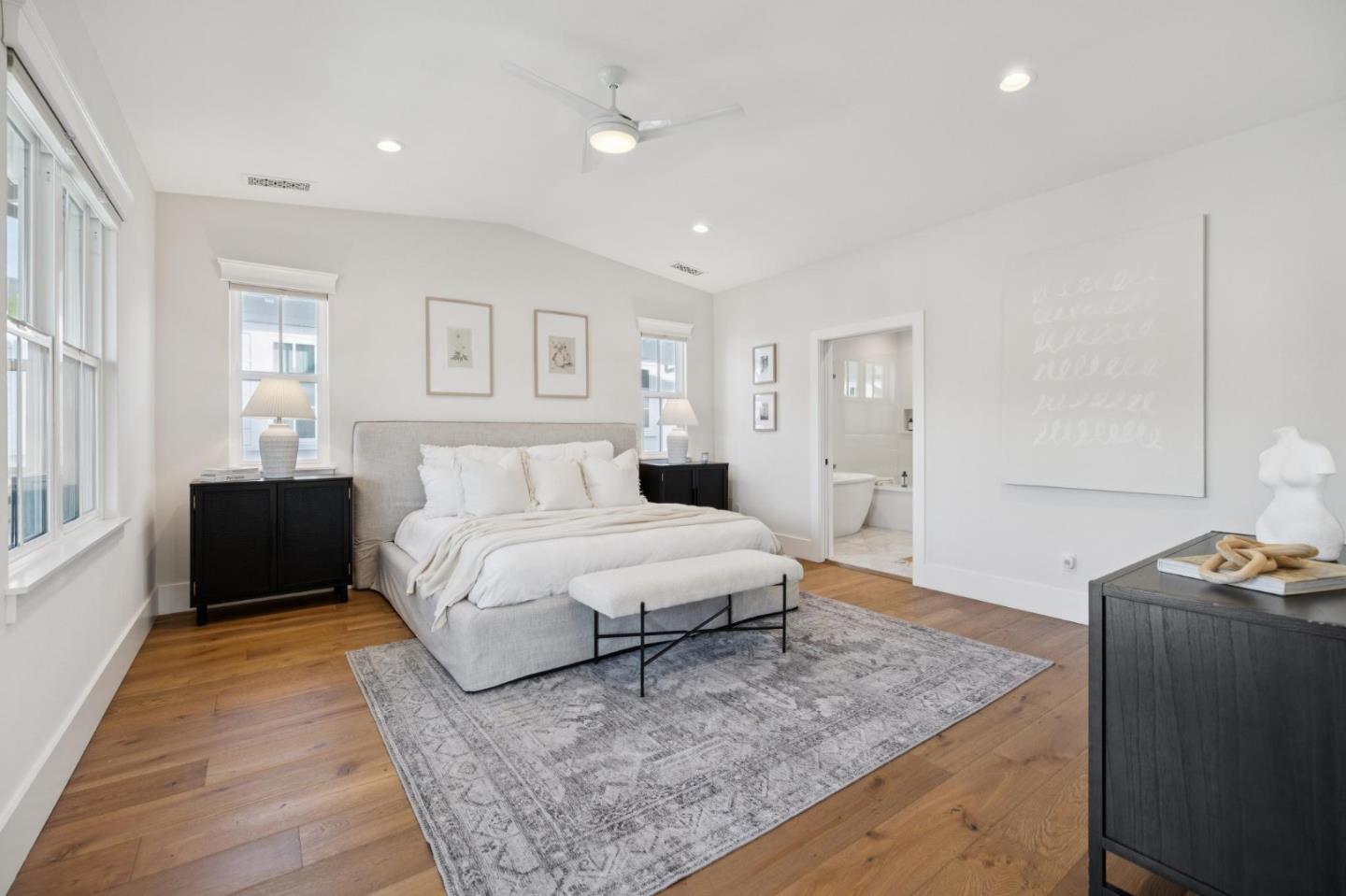 1103 Creed Street Milpitas, CA 95035 - Photo 35 of 74 a spacious bedroom with a bed and a couch