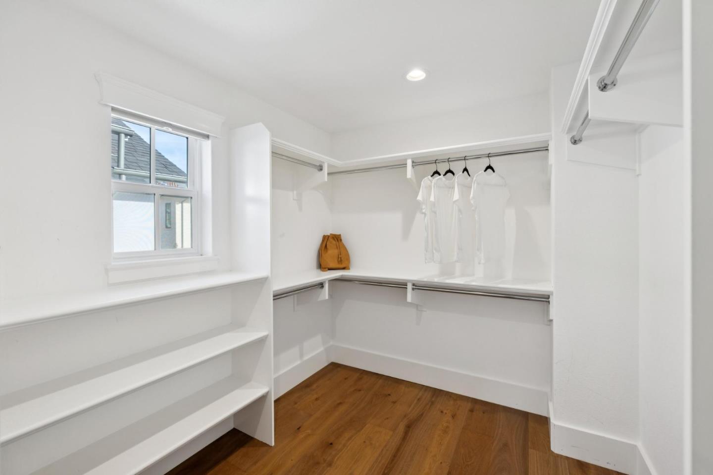 1103 Creed Street Milpitas, CA 95035 - Photo 45 of 74 a view of an empty room with a window and wooden floor