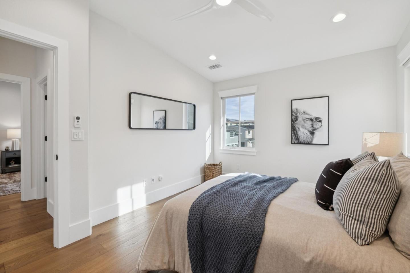 1103 Creed Street Milpitas, CA 95035 - Photo 51 of 74 a bed room with a bed and a painting on the wall