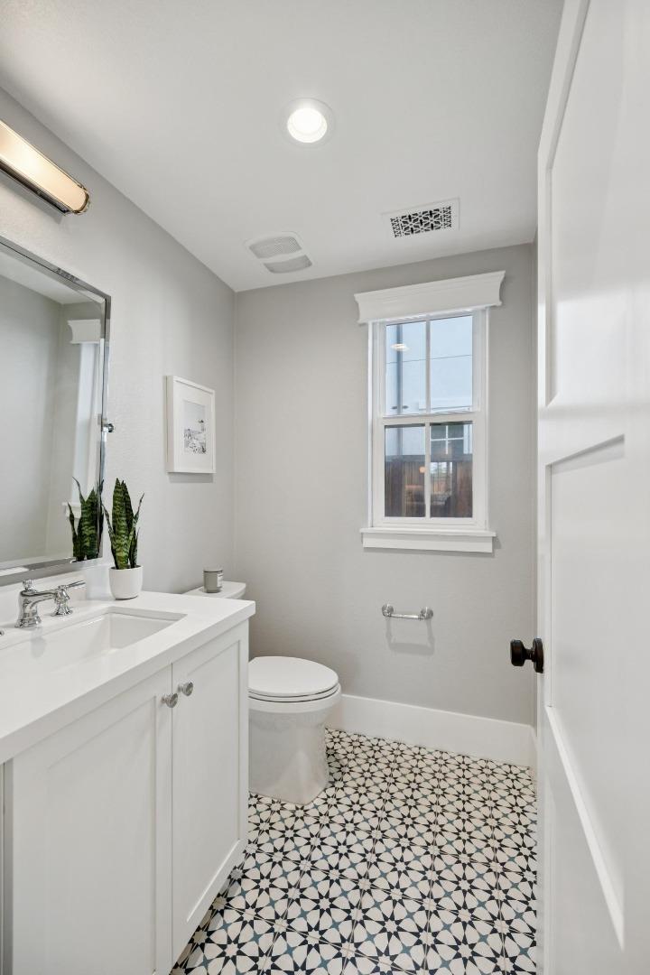 1103 Creed Street Milpitas, CA 95035 - Photo 61 of 74 a bathroom with a sink a toilet a window a vanity and shower