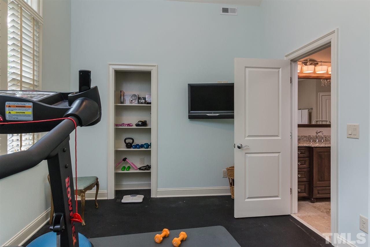 8841 Stage Ford Road Raleigh, NC 27615 - Photo 11 of 25 a view of a workspace with furniture and a window