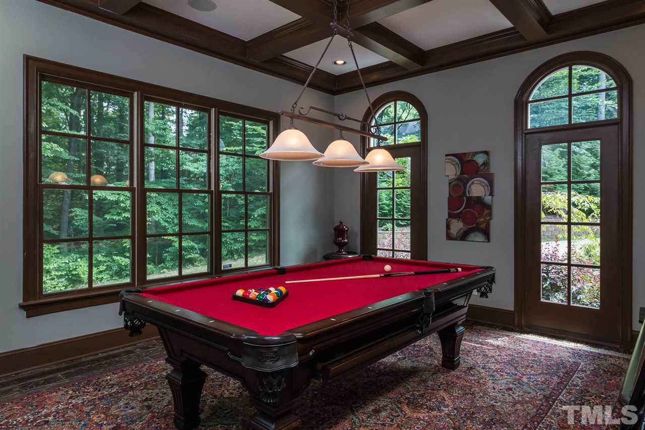 8841 Stage Ford Road Raleigh, NC 27615 - Photo 19 of 25 a room with pool table flat screen tv and windows