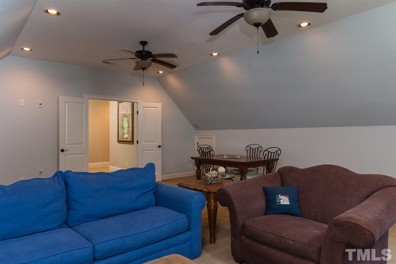 8841 Stage Ford Road Raleigh, NC 27615 - Photo 20 of 25 a living room with furniture