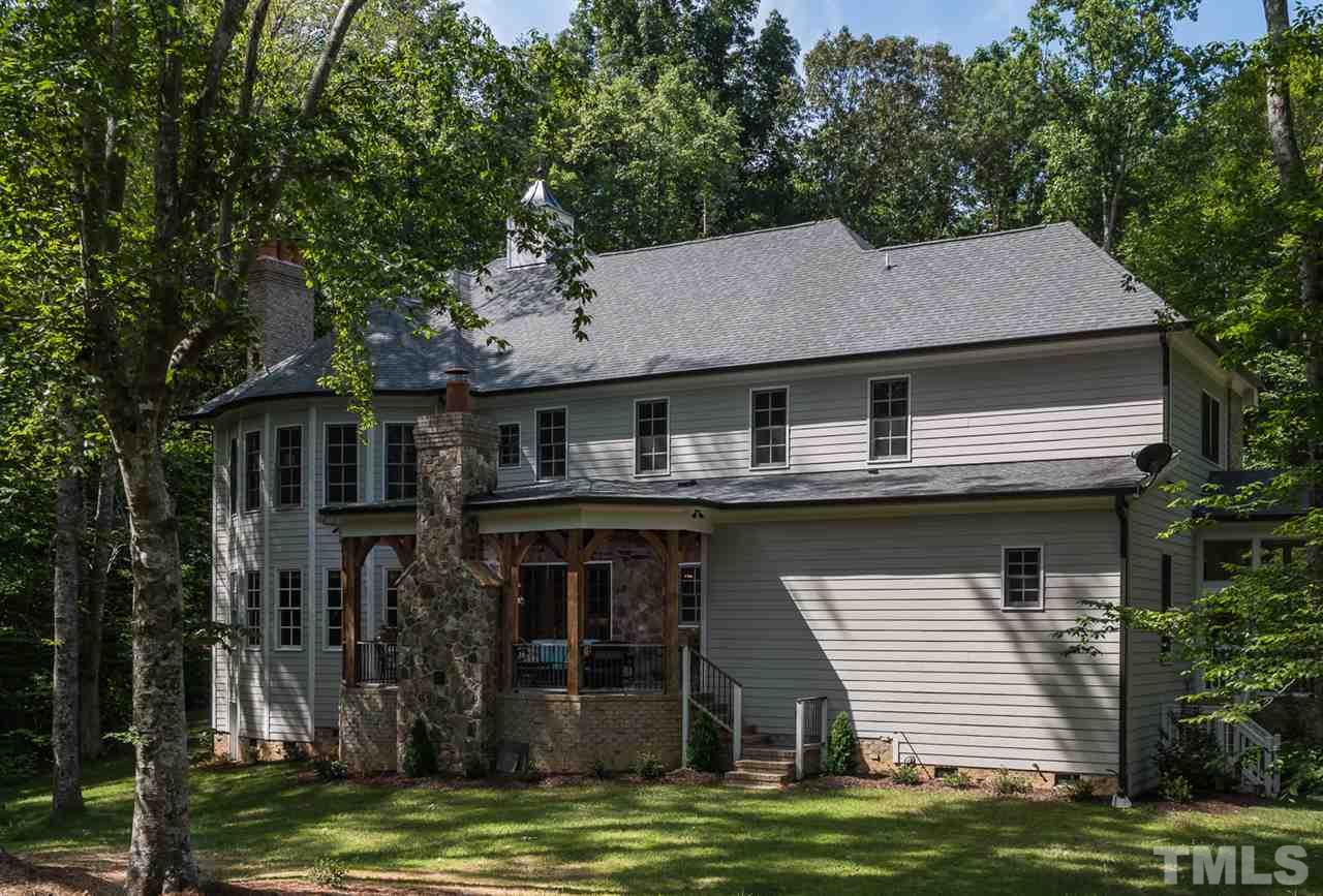 8841 Stage Ford Road Raleigh, NC 27615 - Photo 23 of 25 a house that has a tree in front of it